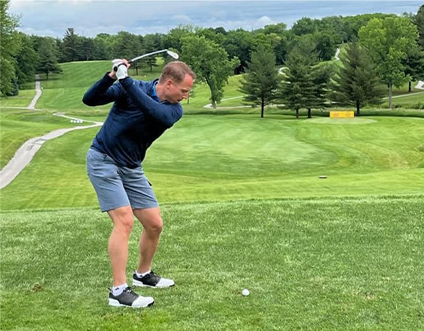 Annual-Golf-Tournament2_09-min Man swinging golf club at Dobbers Up Golf Tournament